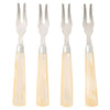 Set of four metal dessert forks with beige handles on a white background