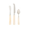 Set of three silver cutlery items with beige handles on a white background